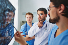 Doctor and specialists analyzing an x-ray result